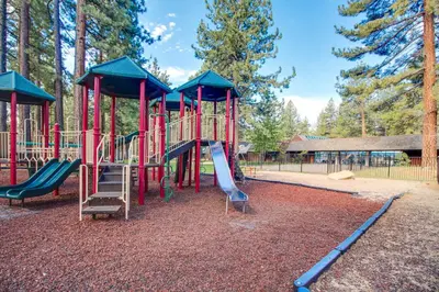 a playground with a slide in a park at Country Club Retreat in South Lake Tahoe