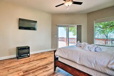 a bedroom with a bed and a ceiling fan at Hot Tub and Mtn Views Peaceful Columbia Retreat! in Columbia