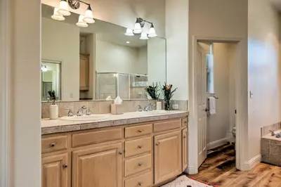 a bathroom with a sink and a large mirror at Hot Tub and Mtn Views Peaceful Columbia Retreat! in Columbia