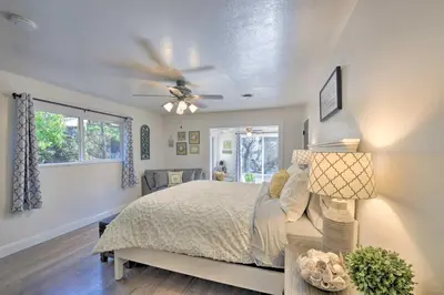 a bedroom with a bed and a ceiling fan at Wine Lovers Garden Oasis in Sutter Creek! in Sutter Creek