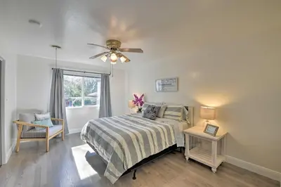 a bedroom with a bed and a ceiling fan at Wine Lovers Garden Oasis in Sutter Creek! in Sutter Creek