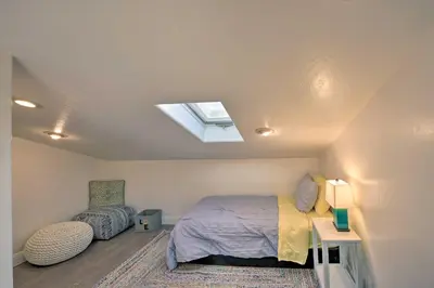 a bedroom with a bed and a skylight at Wine Lovers Garden Oasis in Sutter Creek! in Sutter Creek
