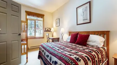 a bedroom with a bed and a window at Sunstone #322 condo in Mammoth Lakes