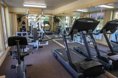 a gym with treadmills and elliptical machines at Sunstone #322 condo in Mammoth Lakes