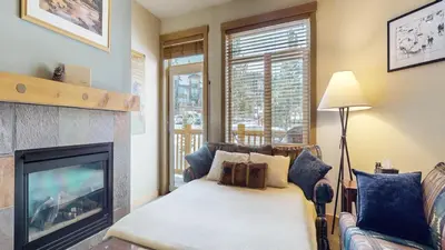 a living room with a couch and a fireplace at Sunstone #322 condo in Mammoth Lakes