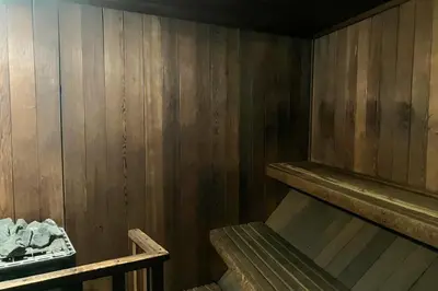 a room with a wooden wall with a bunk bed at St. Moritz 13 in Mammoth Lakes