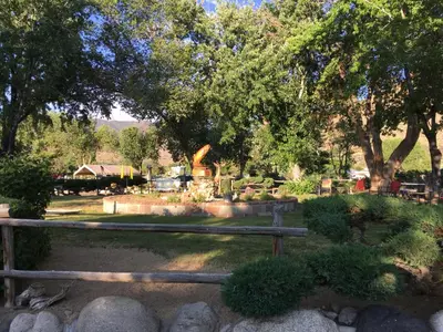 a cemetery with a wooden fence and trees at Toiyabe Motel in Walker