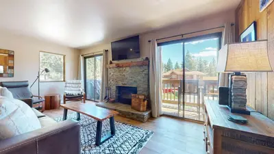 a living room with a couch and a fireplace at Hidden Valley #107 condo in Mammoth Lakes