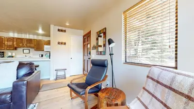 a living room with a couch and a chair at Hidden Valley #107 condo in Mammoth Lakes