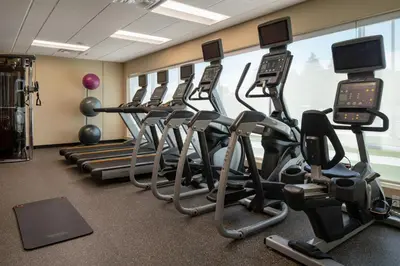 a row of exercise bikes in a gym at TownePlace Suites Fresno Clovis in Clovis