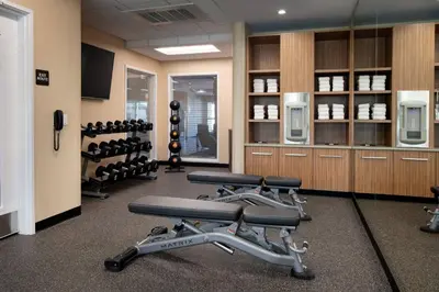 a gym with a row of exercise bikes in it at TownePlace Suites Fresno Clovis in Clovis