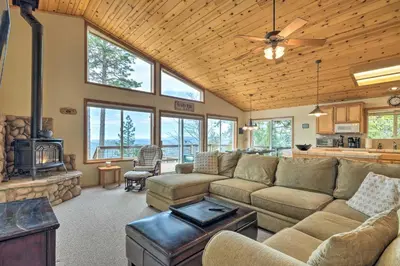 a living room with a couch and a fireplace at Near Hiking Home with Deck in Twain Harte! in Twain Harte