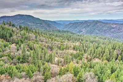 an aerial view of a forest of trees and mountains at Near Hiking Home with Deck in Twain Harte! in Twain Harte