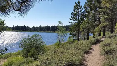 a trail next to a body of water with trees at Marriott Grand Res Q3 #2241 in South Lake Tahoe