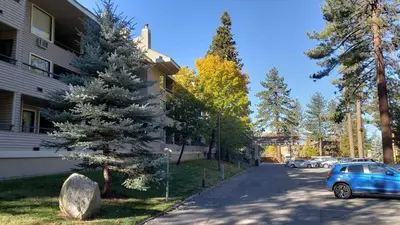 a blue car parked on a street next to a building at Lakeland Village #110 in South Lake Tahoe