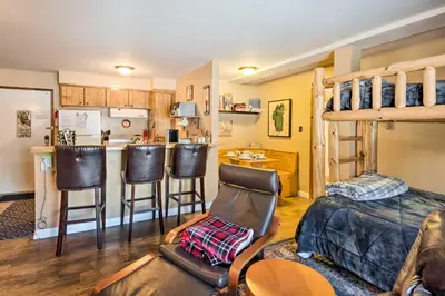 a living room with a bunk bed and a kitchen at Walk to Ski Lift and Village Lovely Kirkwood Condo! in Kirkwood