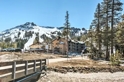 a resort with a mountain in the background at Walk to Ski Lift and Village Lovely Kirkwood Condo! in Kirkwood
