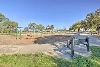 a park with a bench and a playground at Sacramento Area Apartment 15 Mi to Downtown in Antelope