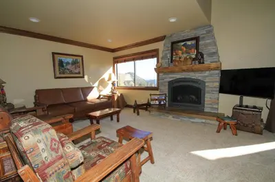 a living room with a couch and a fireplace at Sierra Park Villas #67 in Mammoth Lakes
