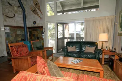 a living room with a couch and a table at SIerra Park Villas #06 in Mammoth Lakes
