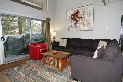 a living room with a couch and a table at Sierra Park Villas 03 in Mammoth Lakes