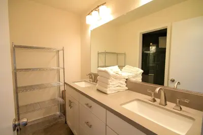a bathroom with two sinks and a large mirror at Sierra Park Villas 93 in Mammoth Lakes