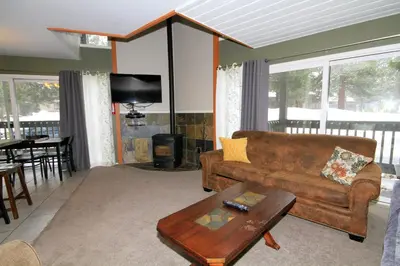 a living room with a couch and a table at Sierra Park Villas 65 in Mammoth Lakes