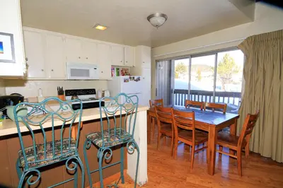 a kitchen and dining room with a table and chairs at Sierra Park Villas 16 in Mammoth Lakes