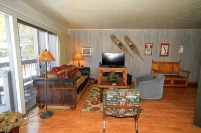 a living room with a couch and a television at Sierra Park Villas 16 in Mammoth Lakes