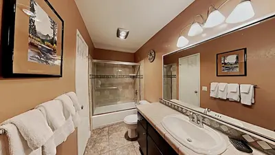 a bathroom with a sink and a shower at Comfy 2-Bedroom Home with Pool in Mammoth Lakes
