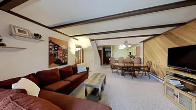 a living room with a couch and a table at Comfortable 2 BR Loft Slope View Condo! in Mammoth Lakes