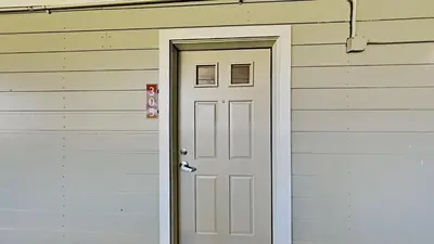 a white door on the side of a house at Beautiful 2 Bedroom Condo with Mountain View! in Mammoth Lakes