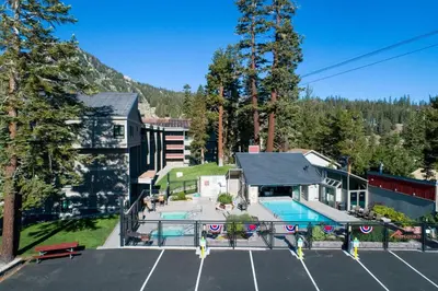 an aerial view of a house with a parking lot at Beautiful 2 Bedroom Condo with Mountain View! in Mammoth Lakes