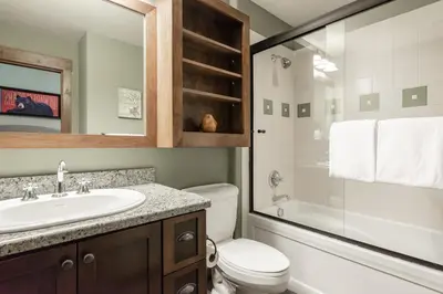 a bathroom with a sink and a toilet and a shower at Woodwinds 22 in Mammoth Lakes