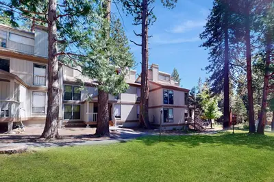 an exterior view of a building with trees at North Lake Loft in Kings Beach