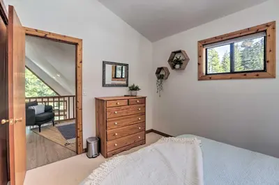 a bedroom with a dresser and a window at Tahoe Donner Retreat with Decks and Lake Access! in Truckee