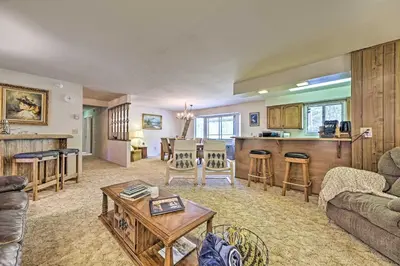 a living room with a couch and a table at Home with Serene Deck in Twain Harte! in Twain Harte