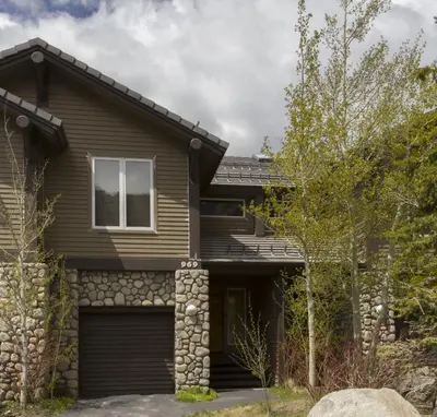 a house with a garage at Mammoth Golf Properties By 101 Great Escapes in Mammoth Lakes