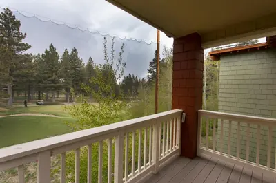a porch with a view of a golf course at Mammoth Golf Properties By 101 Great Escapes in Mammoth Lakes
