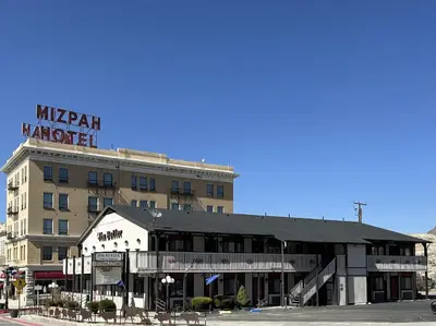 a large building with a sign on top of it at Jim Butler Inn & Suites in Tonopah