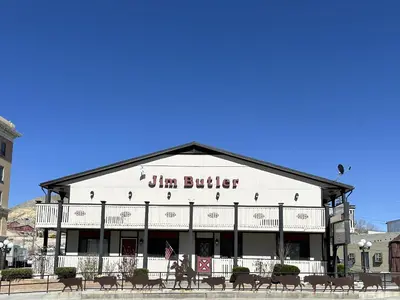 a building with a sign that reads dim butter at Jim Butler Inn & Suites in Tonopah