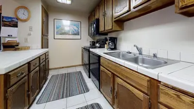 a kitchen with a sink and a stove at Hidden Valley #104 condo in Mammoth Lakes