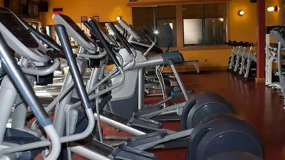 a row of rows of cardio equipment in a gym at Tahoe Donner Pinnacle Loop Mountain Retreat home in Truckee