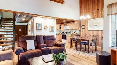a living room with a couch and a table at Val D'Isere #17 condo in Mammoth Lakes