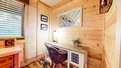a log cabin office with a desk and a window at Forest Creek #29 condo in Mammoth Lakes
