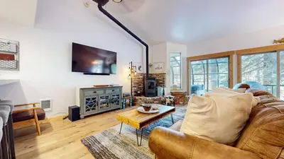a living room with a couch and a table at Forest Creek #29 condo in Mammoth Lakes