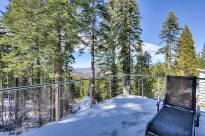 a balcony with a chair in the snow at Canyons Crest in Yosemite West