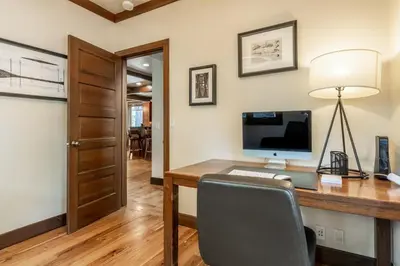 a home office with a desk with a computer on it at Cedar Crest - Owl Cottage 9 in Homewood
