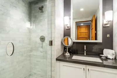 a bathroom with a sink and a mirror at Cedar Crest-Stellars Jay Cottage 4 in Homewood