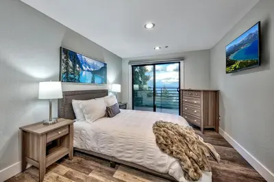 a bedroom with a bed and a large window at LUXE 15 Blue Diamond Lodge Lake Tahoe Hot Tub in Stateline